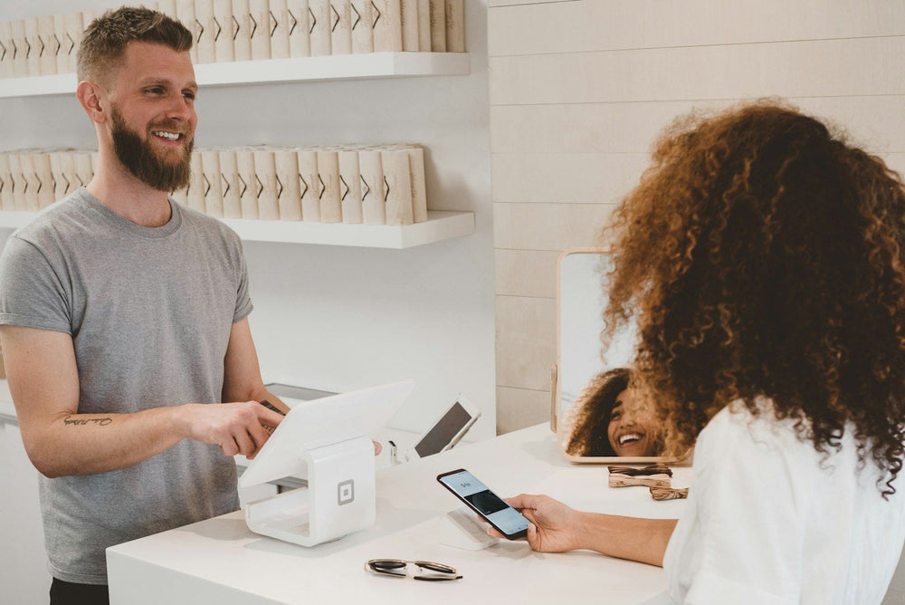 People chatting across a counter